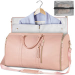 Blush pink waterproof duffle bag open with hanging garment rail, zipper pockets, and mesh organizer