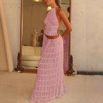 Pink halter crop top and pleated long skirt set with tiered ruffles, side view