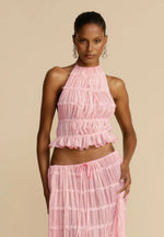 Pink halter crop top and pleated long skirt set with tiered ruffles and elastic waist