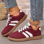 Women's casual sneakers in burgundy with white stripes, lace-up, textured gum sole