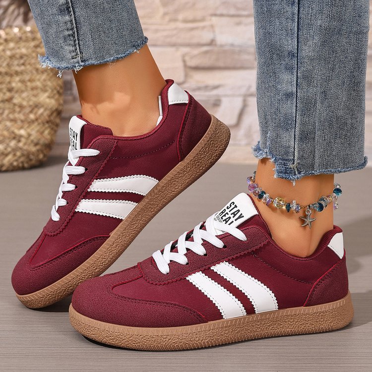 Women's casual sneakers in burgundy with white stripes, lace-up, textured gum sole
