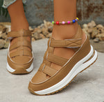 Tan wedge platform sandals with cutout uppers and hook-and-loop straps