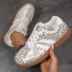 Casual sneakers in white with leopard print and tan rubber sole
