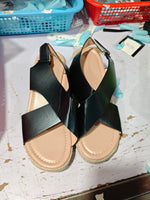 Open-toe wedge sandals with crisscross straps, black PU and tan espadrille platform, pair view
