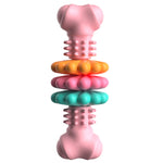 Pink bone-shaped dog chew toy with textured nubs and stacked ring sections.
